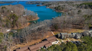 Experience lake life with unending water views, a covered slip on Stone Creek Cove Golf Course in South Carolina - for sale on GolfHomes.com, golf home, golf lot