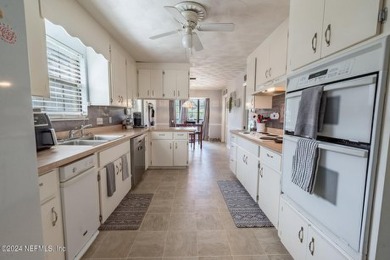 This charming white brick home has 4 bedrooms and 3 baths on Starke Golf and Country Club in Florida - for sale on GolfHomes.com, golf home, golf lot