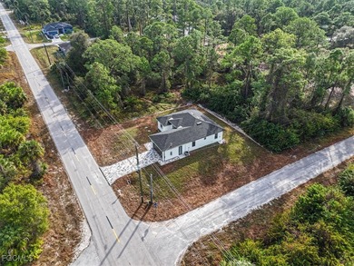 Corner lot new construction offering 3 bedrooms and 2 bathrooms on Lehigh Resort Club in Florida - for sale on GolfHomes.com, golf home, golf lot