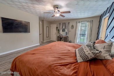 This charming white brick home has 4 bedrooms and 3 baths on Starke Golf and Country Club in Florida - for sale on GolfHomes.com, golf home, golf lot