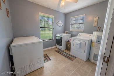 This charming white brick home has 4 bedrooms and 3 baths on Starke Golf and Country Club in Florida - for sale on GolfHomes.com, golf home, golf lot