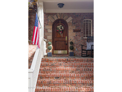 Privately nestled among mature trees with pond views and views on Porters Neck Country Club in North Carolina - for sale on GolfHomes.com, golf home, golf lot