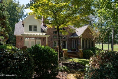 Privately nestled among mature trees with pond views and views on Porters Neck Country Club in North Carolina - for sale on GolfHomes.com, golf home, golf lot