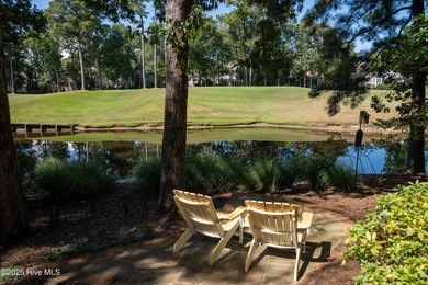 Privately nestled among mature trees with pond views and views on Porters Neck Country Club in North Carolina - for sale on GolfHomes.com, golf home, golf lot