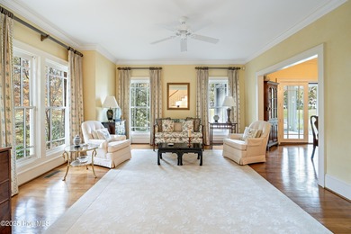 Privately nestled among mature trees with pond views and views on Porters Neck Country Club in North Carolina - for sale on GolfHomes.com, golf home, golf lot