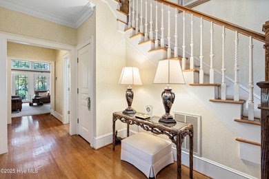 Privately nestled among mature trees with pond views and views on Porters Neck Country Club in North Carolina - for sale on GolfHomes.com, golf home, golf lot