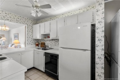 Don't miss this 2-bed, 2-bath condominium in the private on Miles Grant Country Club in Florida - for sale on GolfHomes.com, golf home, golf lot