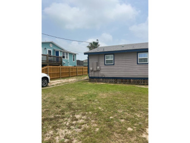 This adorable cozy coastal cottage sits on a large lot just 2 on Rockport Country Club in Texas - for sale on GolfHomes.com, golf home, golf lot