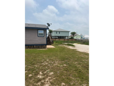 This adorable cozy coastal cottage sits on a large lot just 2 on Rockport Country Club in Texas - for sale on GolfHomes.com, golf home, golf lot