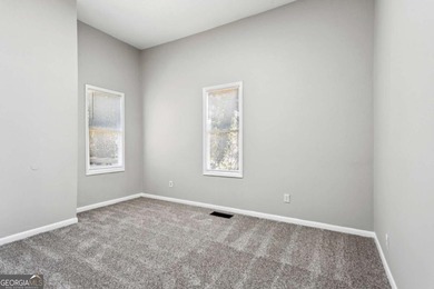 Welcome home to this bright and inviting 3-bedroom, 2-bath home on John A. White Golf Course in Georgia - for sale on GolfHomes.com, golf home, golf lot