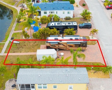 Prime Location RV Lot in Exclusive Clothing-Optional Community - on The Groves Golf and Country Club in Florida - for sale on GolfHomes.com, golf home, golf lot