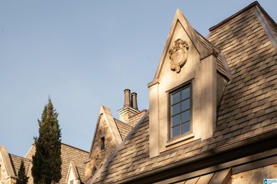 Designed by Atlanta architect Durham Crout, this French Normandy on Shoal Creek Golf Course in Alabama - for sale on GolfHomes.com, golf home, golf lot