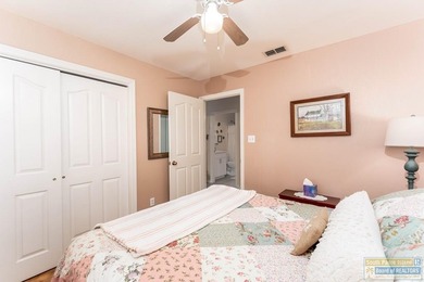 Inviting lakefront home with golf course views, set along a on South Padre Island Golf Club in Texas - for sale on GolfHomes.com, golf home, golf lot