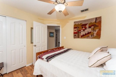 Inviting lakefront home with golf course views, set along a on South Padre Island Golf Club in Texas - for sale on GolfHomes.com, golf home, golf lot