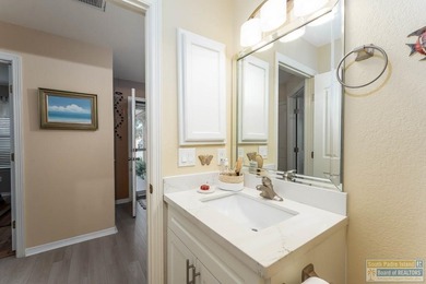 Inviting lakefront home with golf course views, set along a on South Padre Island Golf Club in Texas - for sale on GolfHomes.com, golf home, golf lot