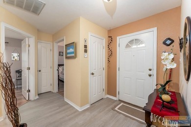 Inviting lakefront home with golf course views, set along a on South Padre Island Golf Club in Texas - for sale on GolfHomes.com, golf home, golf lot