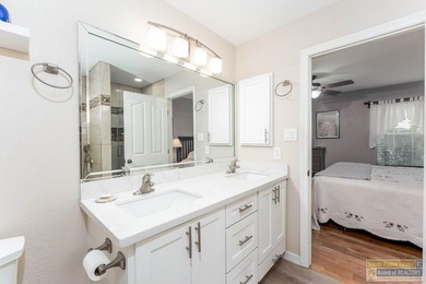 Inviting lakefront home with golf course views, set along a on South Padre Island Golf Club in Texas - for sale on GolfHomes.com, golf home, golf lot