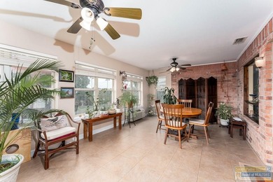 Inviting lakefront home with golf course views, set along a on South Padre Island Golf Club in Texas - for sale on GolfHomes.com, golf home, golf lot