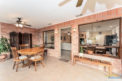 Inviting lakefront home with golf course views, set along a on South Padre Island Golf Club in Texas - for sale on GolfHomes.com, golf home, golf lot