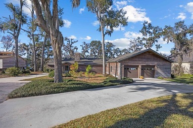 Discover this beautifully preserved mid-century lake house on Francis Lake Golf Club in Georgia - for sale on GolfHomes.com, golf home, golf lot