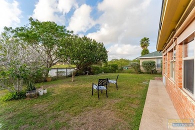 Inviting lakefront home with golf course views, set along a on South Padre Island Golf Club in Texas - for sale on GolfHomes.com, golf home, golf lot