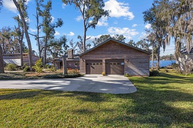 Discover this beautifully preserved mid-century lake house on Francis Lake Golf Club in Georgia - for sale on GolfHomes.com, golf home, golf lot