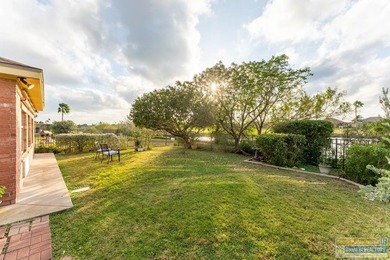 Inviting lakefront home with golf course views, set along a on South Padre Island Golf Club in Texas - for sale on GolfHomes.com, golf home, golf lot