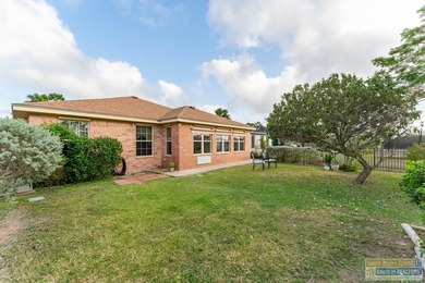 Inviting lakefront home with golf course views, set along a on South Padre Island Golf Club in Texas - for sale on GolfHomes.com, golf home, golf lot