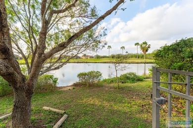 Inviting lakefront home with golf course views, set along a on South Padre Island Golf Club in Texas - for sale on GolfHomes.com, golf home, golf lot