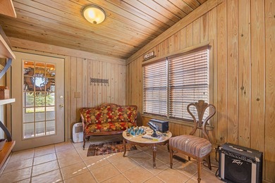 Discover this beautifully preserved mid-century lake house on Francis Lake Golf Club in Georgia - for sale on GolfHomes.com, golf home, golf lot