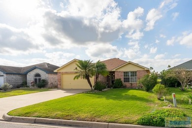 Inviting lakefront home with golf course views, set along a on South Padre Island Golf Club in Texas - for sale on GolfHomes.com, golf home, golf lot