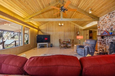 Discover this beautifully preserved mid-century lake house on Francis Lake Golf Club in Georgia - for sale on GolfHomes.com, golf home, golf lot