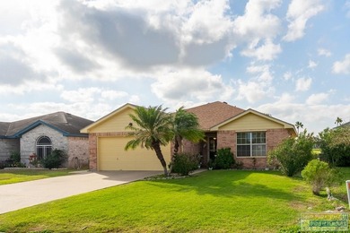 Inviting lakefront home with golf course views, set along a on South Padre Island Golf Club in Texas - for sale on GolfHomes.com, golf home, golf lot