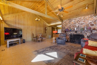 Discover this beautifully preserved mid-century lake house on Francis Lake Golf Club in Georgia - for sale on GolfHomes.com, golf home, golf lot