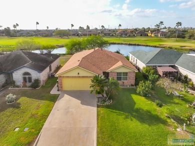 Inviting lakefront home with golf course views, set along a on South Padre Island Golf Club in Texas - for sale on GolfHomes.com, golf home, golf lot