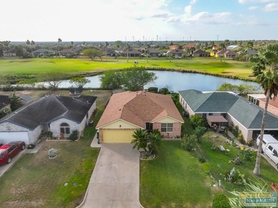 Inviting lakefront home with golf course views, set along a on South Padre Island Golf Club in Texas - for sale on GolfHomes.com, golf home, golf lot