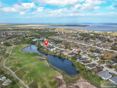 Inviting lakefront home with golf course views, set along a on South Padre Island Golf Club in Texas - for sale on GolfHomes.com, golf home, golf lot
