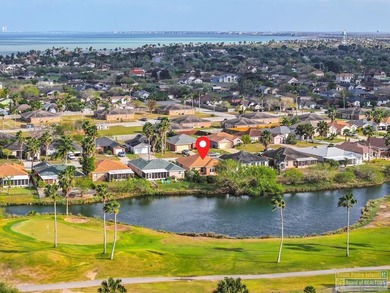 Inviting lakefront home with golf course views, set along a on South Padre Island Golf Club in Texas - for sale on GolfHomes.com, golf home, golf lot