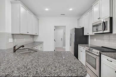 This beautifully maintained residence is set within the popular on Magnolia Greens Golf Plantation in North Carolina - for sale on GolfHomes.com, golf home, golf lot