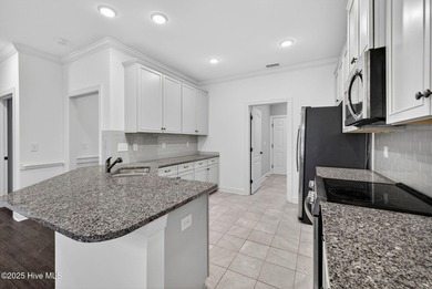 This beautifully maintained residence is set within the popular on Magnolia Greens Golf Plantation in North Carolina - for sale on GolfHomes.com, golf home, golf lot