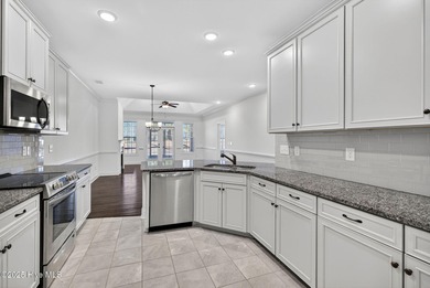 This beautifully maintained residence is set within the popular on Magnolia Greens Golf Plantation in North Carolina - for sale on GolfHomes.com, golf home, golf lot