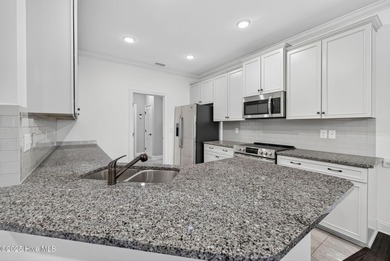 This beautifully maintained residence is set within the popular on Magnolia Greens Golf Plantation in North Carolina - for sale on GolfHomes.com, golf home, golf lot