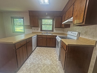 Nestled along the coveted North Golf Course in Cherokee Village on Cherokee Village North Course in Arkansas - for sale on GolfHomes.com, golf home, golf lot