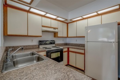 Enjoy the privacy and comfort of a large, split floorplan villa on Highland Lakes Executive Golf Course in Florida - for sale on GolfHomes.com, golf home, golf lot