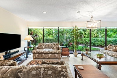 Discover the ultimate blend of elegance and effortless living in on Quail Ridge Golf Course and Country Club in Florida - for sale on GolfHomes.com, golf home, golf lot