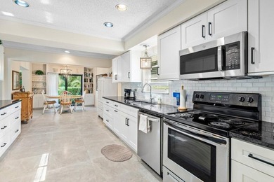 Discover the ultimate blend of elegance and effortless living in on Quail Ridge Golf Course and Country Club in Florida - for sale on GolfHomes.com, golf home, golf lot