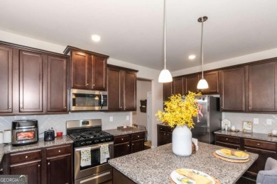Set on a large golf course lot, this 5 bedroom, 4 bath home on The Club at Shoal Creek Golf Course in Georgia - for sale on GolfHomes.com, golf home, golf lot