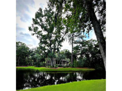 This stunning residence in the private Long Cove Club boasts on Long Cove Club in South Carolina - for sale on GolfHomes.com, golf home, golf lot