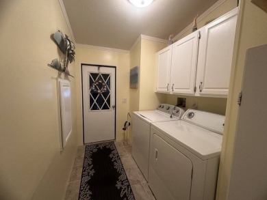 This charming 2-bedroom, 2-bath home offers 1,612 sq ft of on Del Tura Golf and Country Club in Florida - for sale on GolfHomes.com, golf home, golf lot