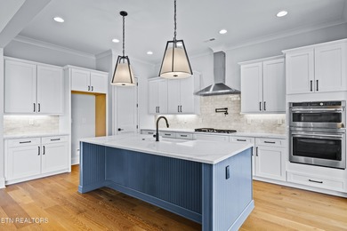 This beautifully appointed 4-bedroom, 3-bath residence offers 3 on Tennessee National Golf Club in Tennessee - for sale on GolfHomes.com, golf home, golf lot